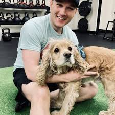 Eric with Scout the dog at First Guess Fitness